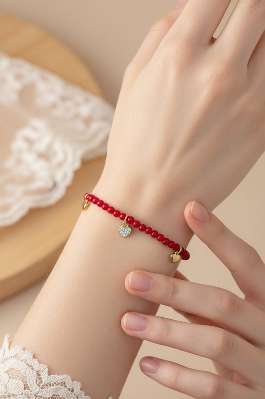 “Siena” – Bracelet with red pearls &amp; gold-plated 925 sterling silver heart pendants