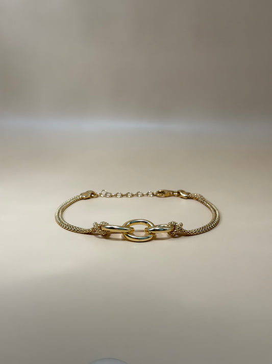 "Ferrara" – Bracciale con anelli intrecciati in argento placcato oro